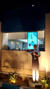 High brightness digital signage display in retail storefront window with sunlight readable LCD screen technology