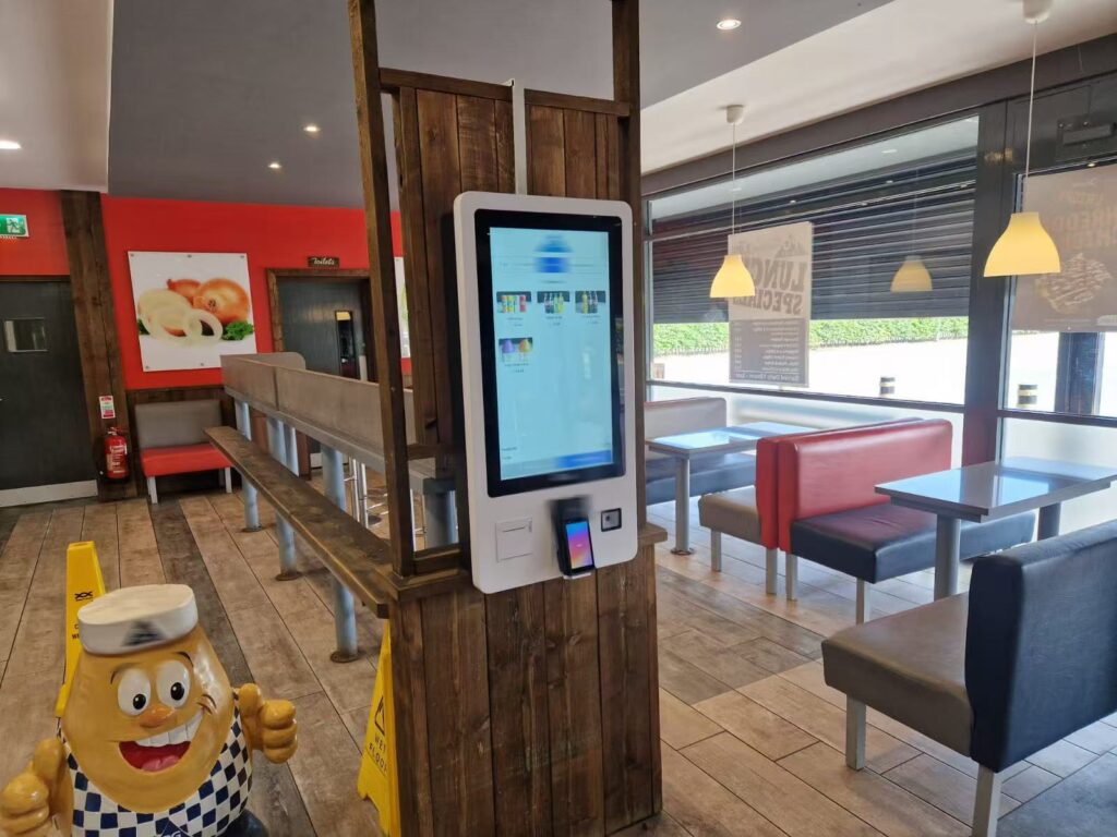 Self-service ordering kiosks with touchscreen displays for fast food restaurant QSR digital menu and payment system