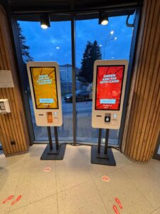 Self-service ordering kiosks with touchscreen displays for fast food restaurant QSR digital menu and payment system