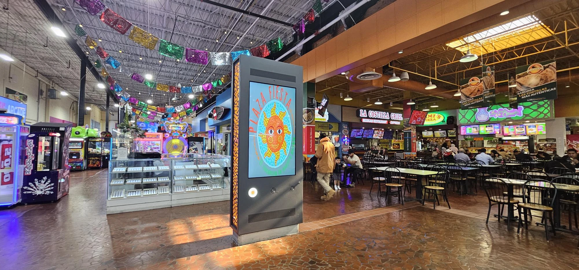 Custom YJCEN floor-standing digital signage installed in the food court at Plaza Fiesta in Atlanta.