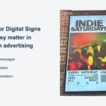 A YJCEN outdoor display mounted on a brick wall shows an event advertisement beside the article title.