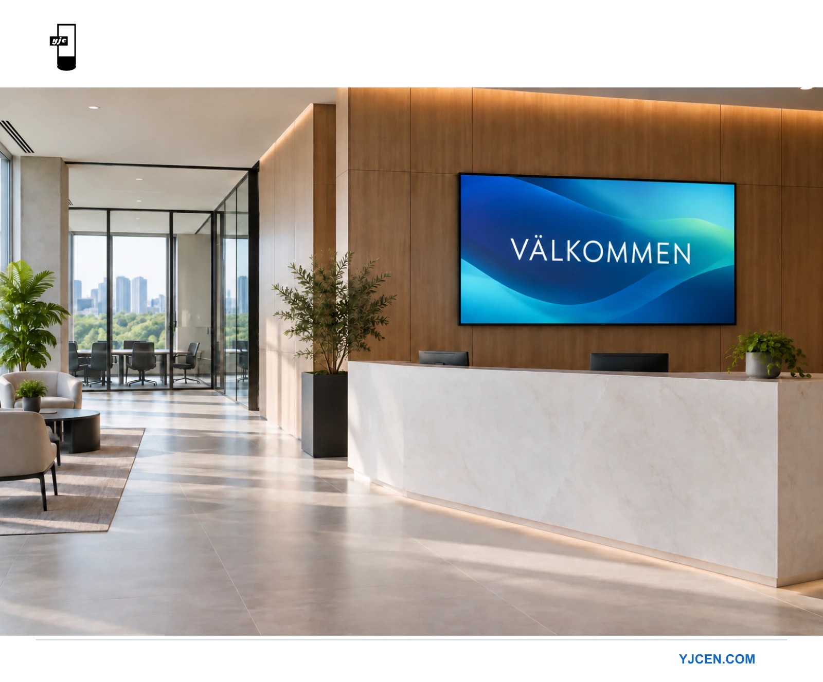 Väggmonterad välkomstskärm bakom en modern receptionsdisk