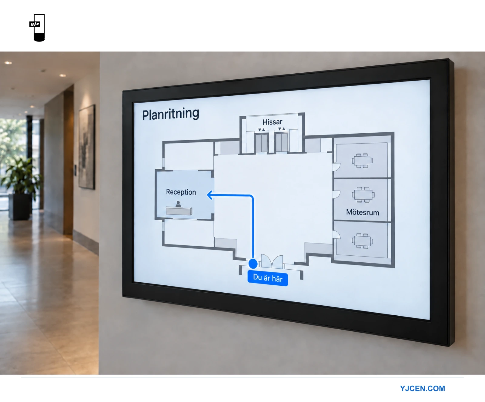 Närbild av en digital informationstavla med markören Här är du, reception, mötesrum och hissar på en enkel våningskarta.